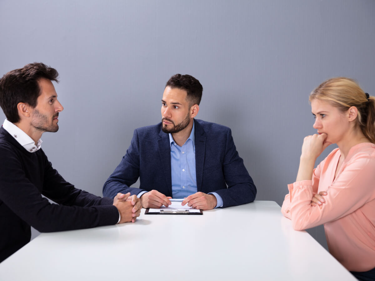 couple-discussing-with-lawyer