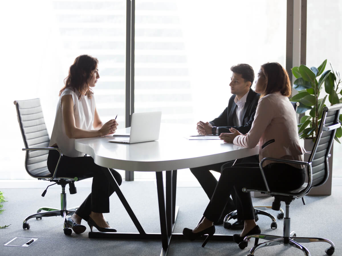 couple-talking-with-female-lawyer