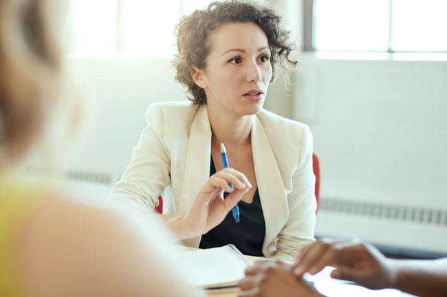 Female-lawyer-with-clients-cropped