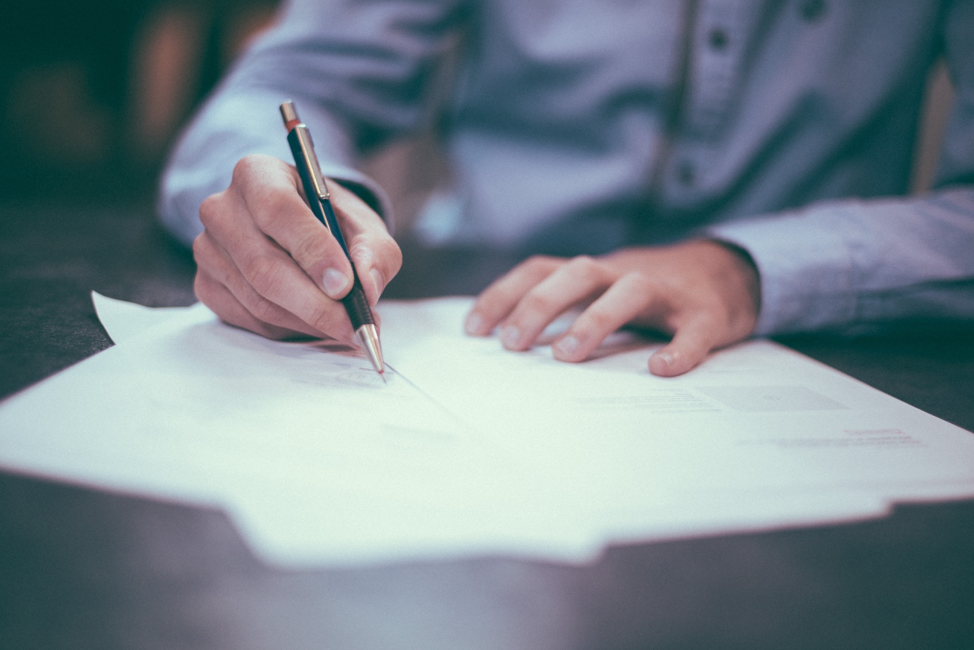 a lawyer signing an official document