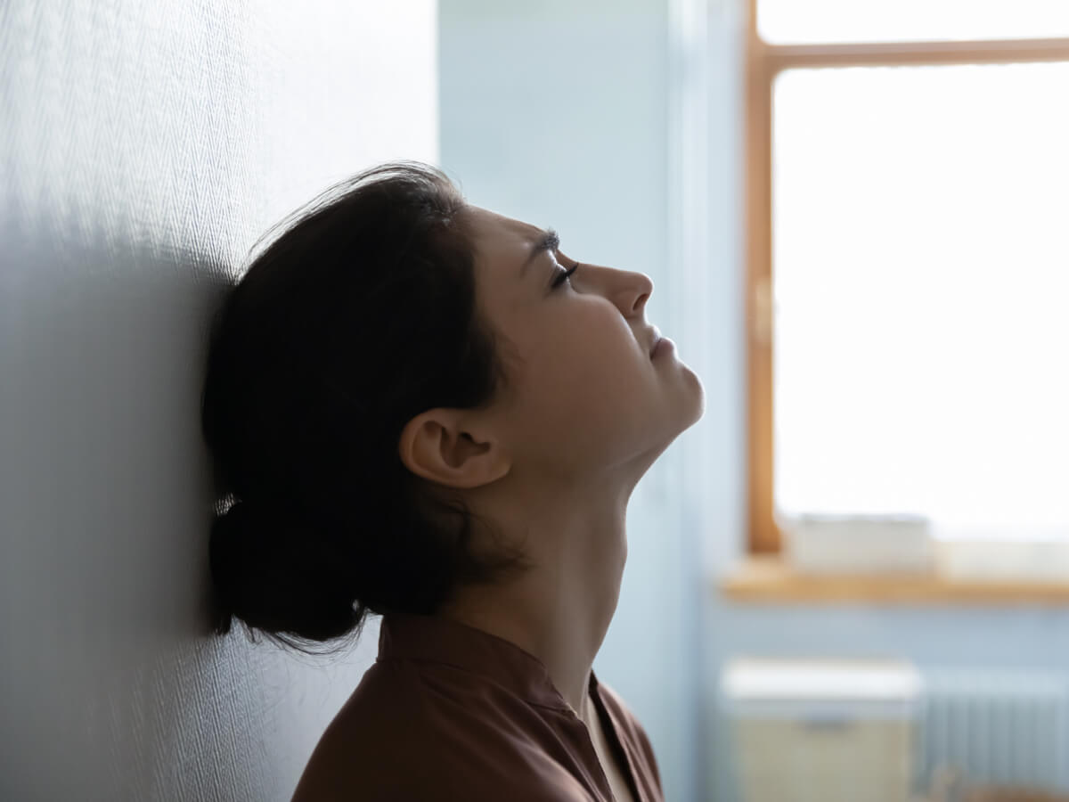 upset female against wall