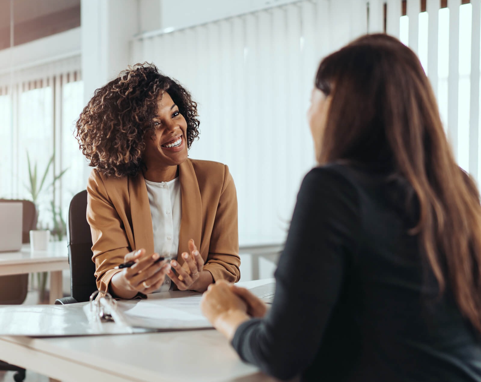 two women having a consultation (happy)