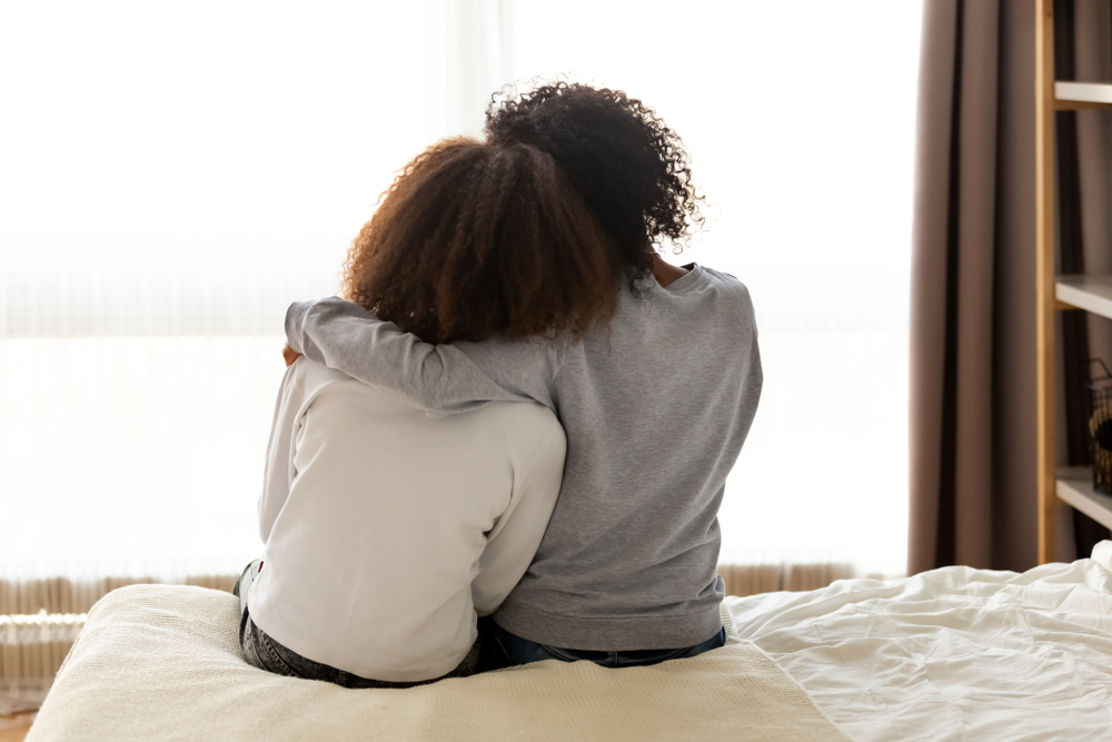 mom daughter hugging