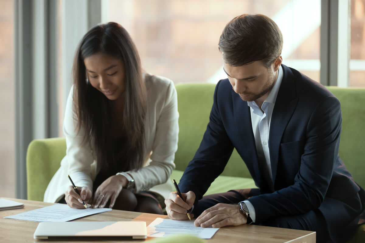 couple-signing-documents