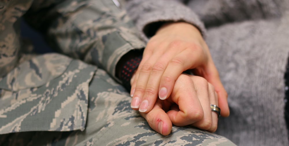 military-couple-holding-hands